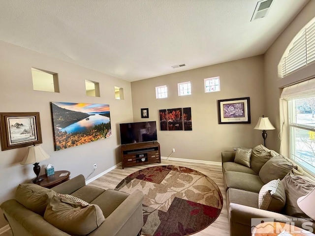 living room with light hardwood / wood-style flooring