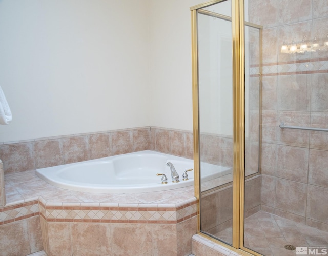 bathroom with shower with separate bathtub