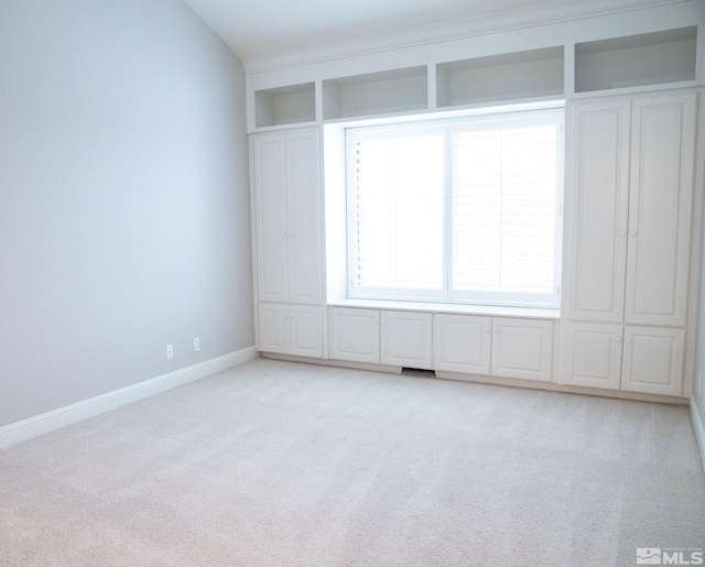 unfurnished room with light colored carpet