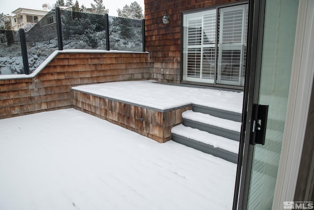 view of snow covered deck