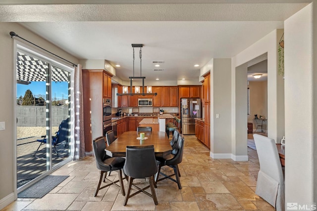 dining room featuring a textured ceiling