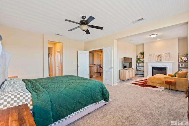 carpeted bedroom with ceiling fan