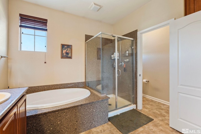 bathroom with vanity and independent shower and bath