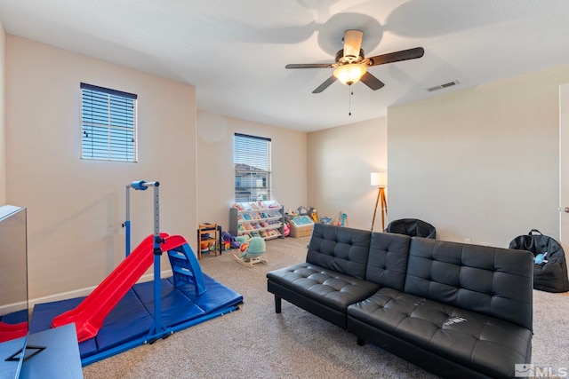 game room featuring ceiling fan and carpet flooring