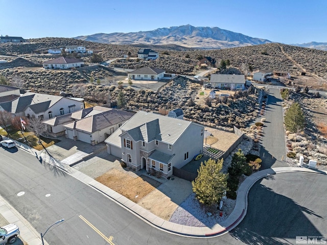 birds eye view of property featuring a mountain view