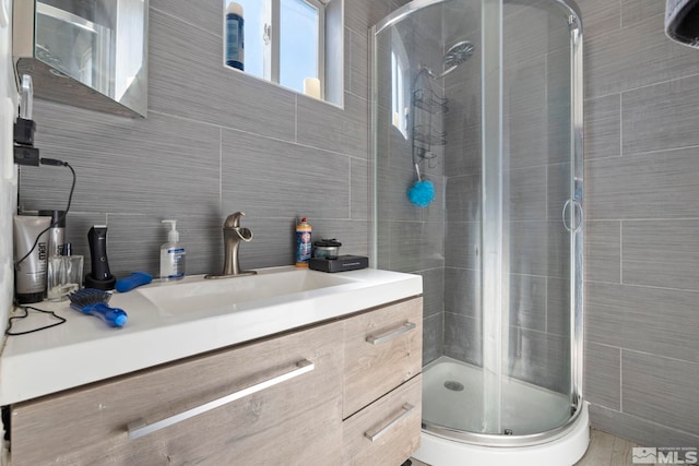 bathroom with walk in shower and vanity