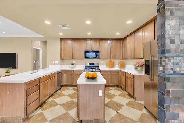 kitchen with sink, a kitchen island, kitchen peninsula, and appliances with stainless steel finishes