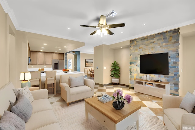 living room featuring crown molding and ceiling fan