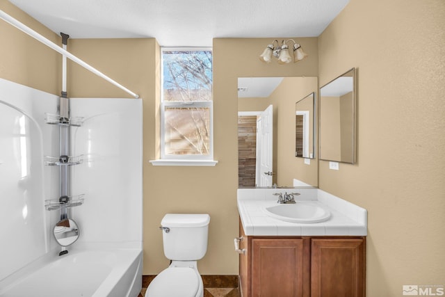 full bathroom with vanity, shower / washtub combination, and toilet