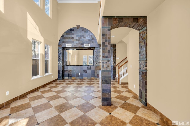 interior space featuring a towering ceiling