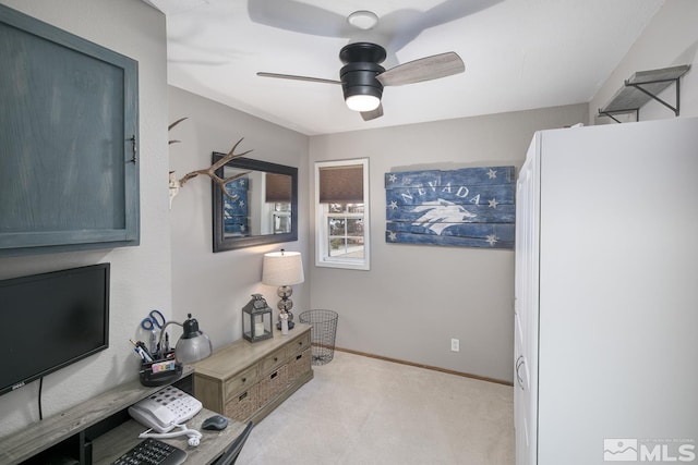 sitting room with ceiling fan and light colored carpet