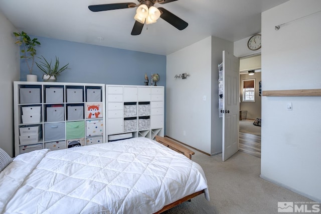 bedroom featuring ceiling fan and light colored carpet