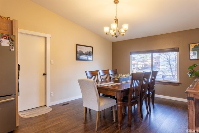 dining space featuring vaulted ceiling, a notable chandelier, and dark hardwood / wood-style flooring