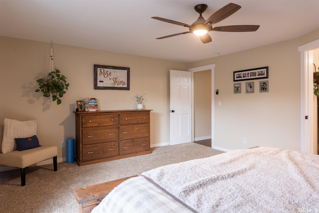 bedroom with ceiling fan and light colored carpet