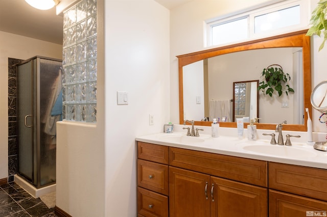 bathroom featuring vanity and a shower with door