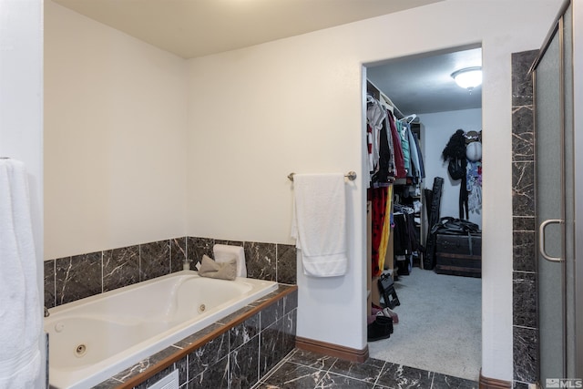 bathroom featuring a relaxing tiled tub