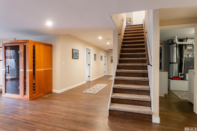 stairway featuring hardwood / wood-style floors