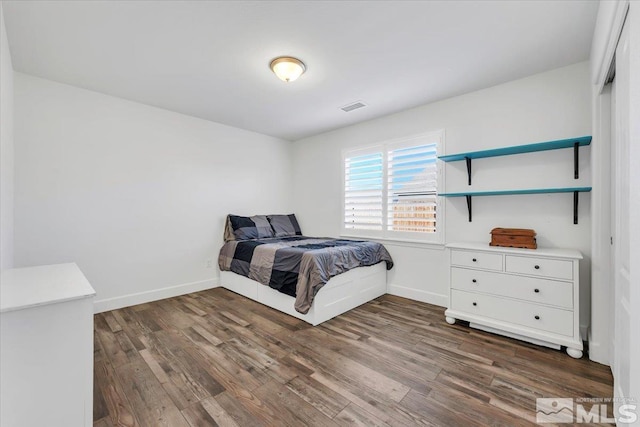 bedroom featuring dark hardwood / wood-style floors