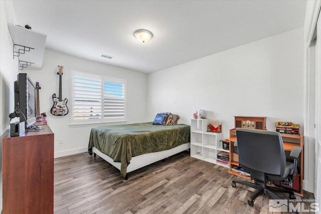 bedroom featuring hardwood / wood-style flooring