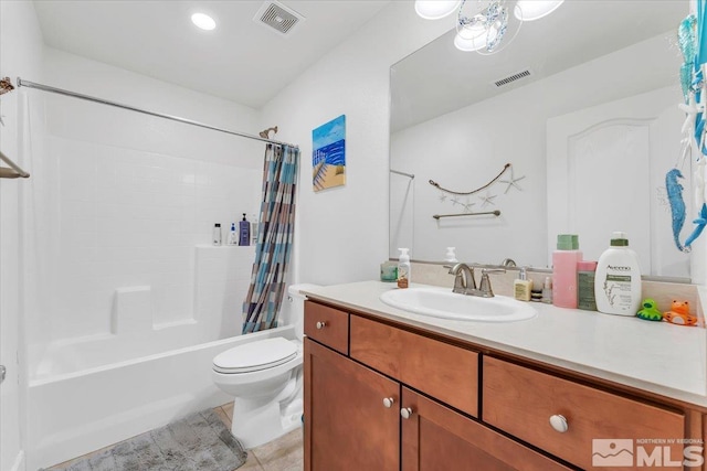 full bathroom featuring vanity, shower / bath combination with curtain, tile patterned floors, and toilet