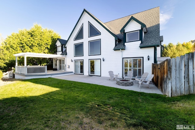 rear view of house featuring a pergola, a yard, a fire pit, and a patio