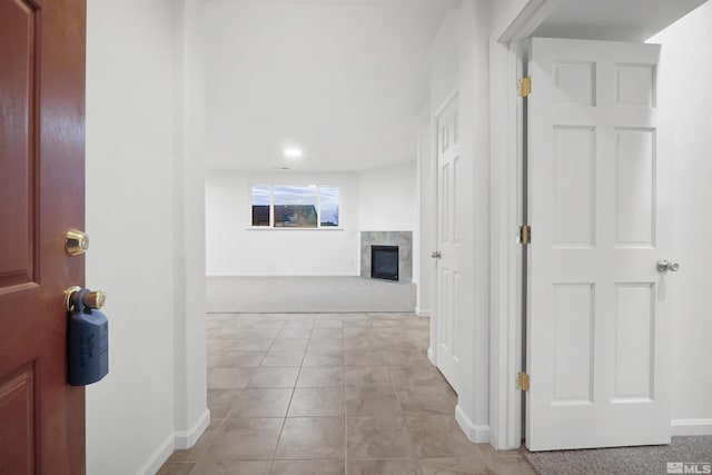 hall with light tile patterned flooring