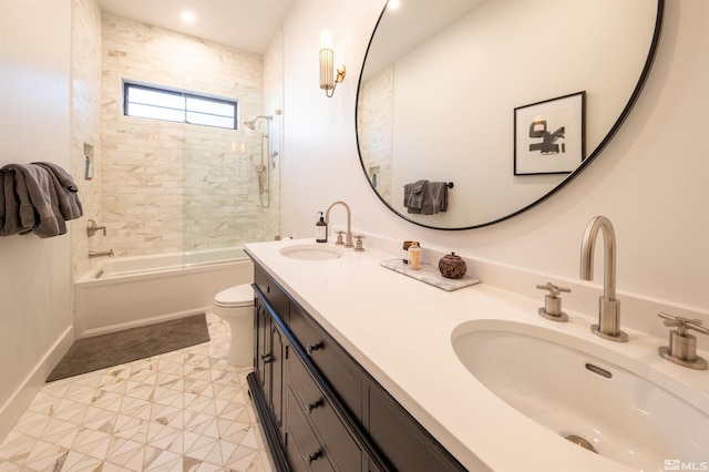 full bathroom with vanity, toilet, and tiled shower / bath