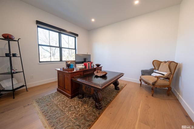 office space with light wood-type flooring