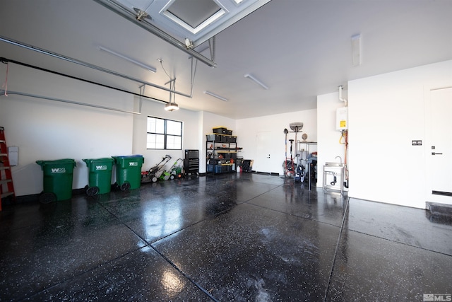 garage featuring a garage door opener and water heater