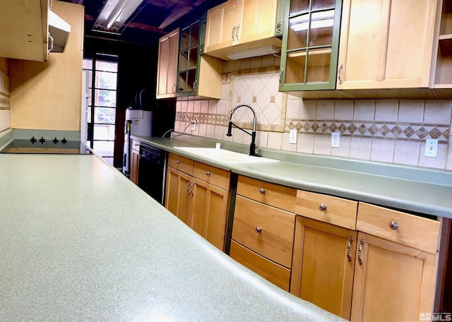 kitchen with sink, light brown cabinets, backsplash, and black appliances