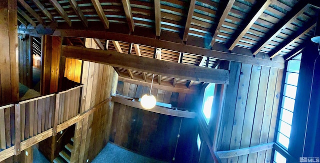 room details with wood ceiling, beam ceiling, and wood walls