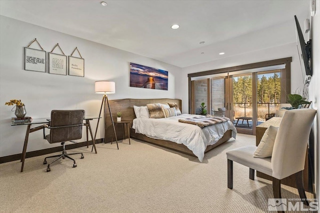 carpeted bedroom featuring access to outside