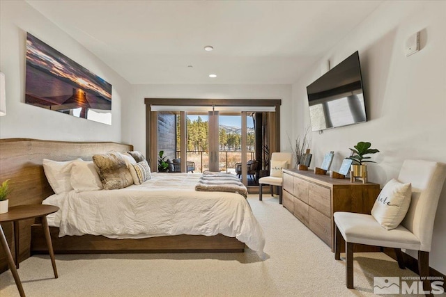 bedroom with french doors, light colored carpet, and access to outside