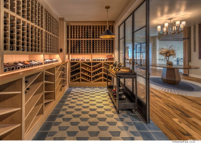 wine room with an inviting chandelier