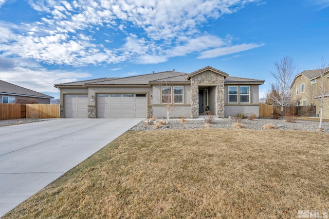 view of front facade with a garage and a front lawn