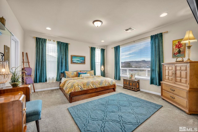 bedroom featuring light carpet