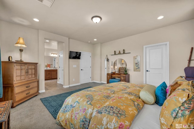 carpeted bedroom with connected bathroom