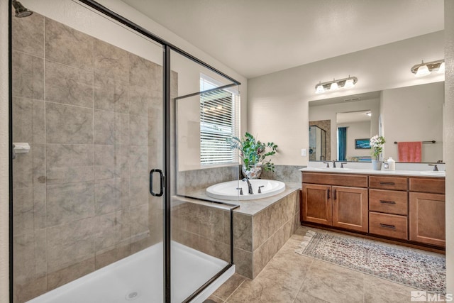 bathroom with independent shower and bath, vanity, and tile patterned flooring