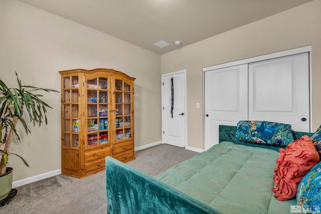 carpeted bedroom with a closet