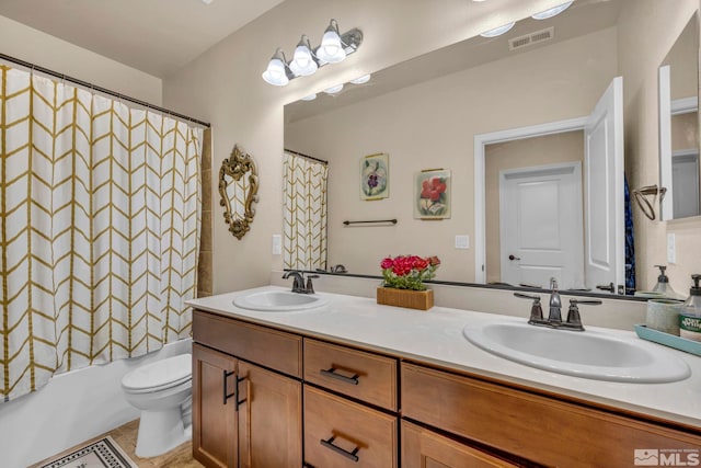 full bathroom featuring vanity, toilet, and shower / tub combo with curtain