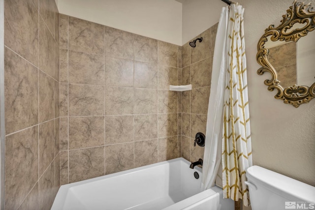 bathroom with toilet and shower / bath combo with shower curtain