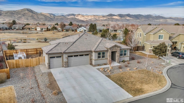 view of front of home featuring a mountain view and a garage