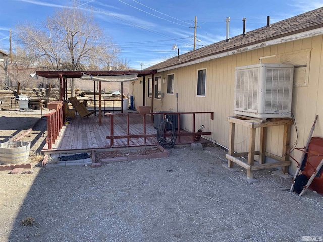 view of property exterior featuring a deck and central air condition unit