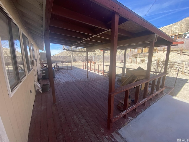 deck featuring cooling unit and a mountain view