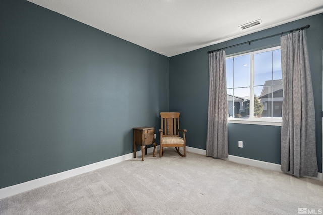 sitting room featuring carpet floors