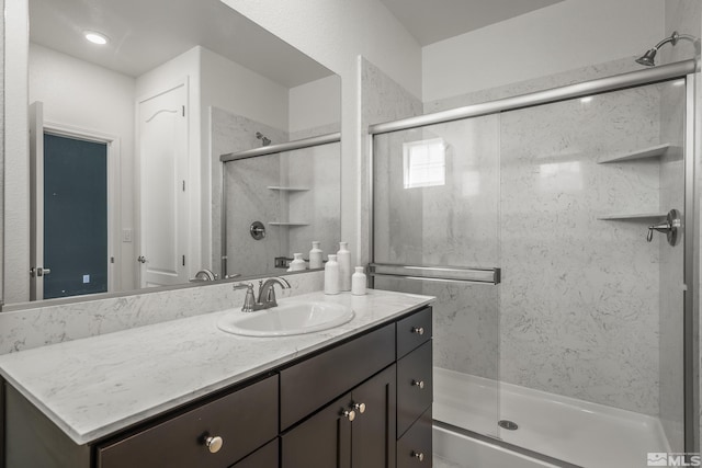 bathroom with vanity and walk in shower