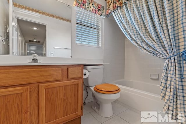 full bathroom with tile patterned floors, toilet, shower / tub combo, and vanity