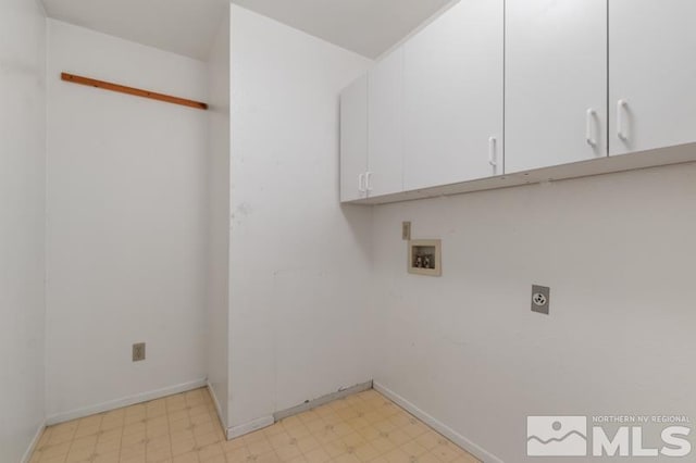 laundry room featuring cabinets, hookup for a washing machine, and hookup for an electric dryer