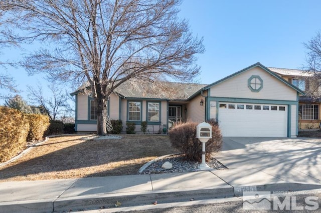 ranch-style home featuring a garage