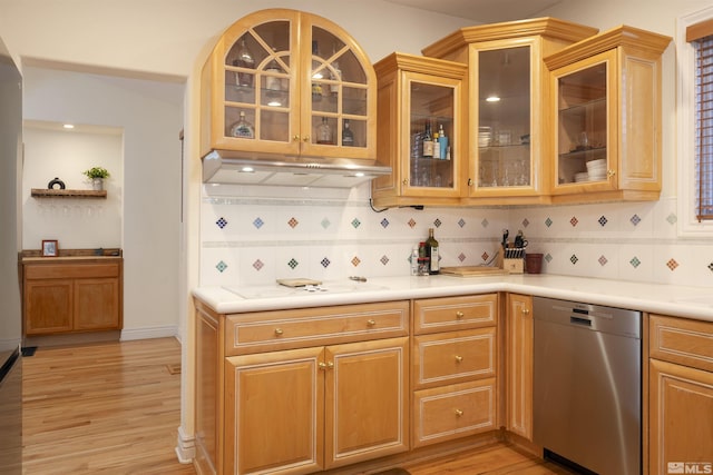 kitchen featuring tasteful backsplash, white cooktop, dishwasher, and light hardwood / wood-style flooring